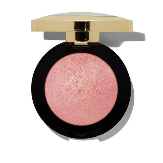 Compact blush with a gold lid on a white background