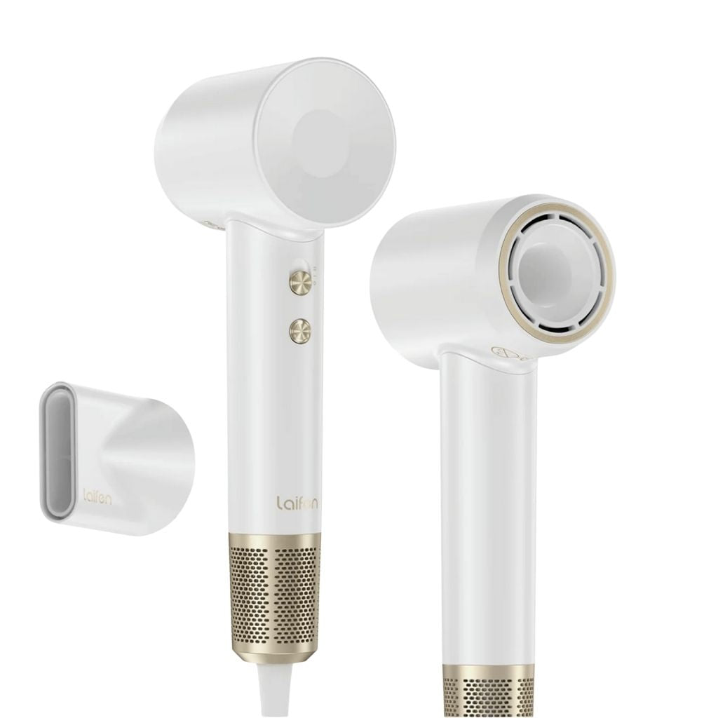 White and gold hair dryer with attachments on a white background