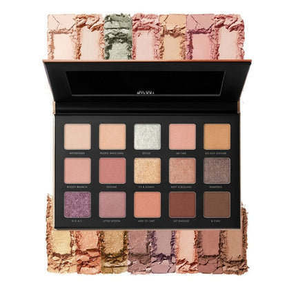 Makeup palette with various shades of eyeshadow on a white background