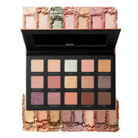 Makeup palette with various shades of eyeshadow on a white background