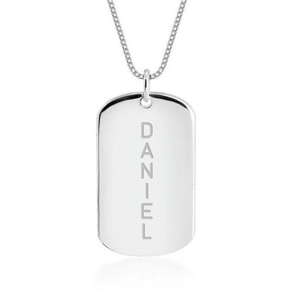 Silver dog tag necklace with 'DANIEL' engraving on a white background