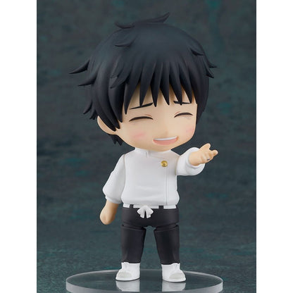 Figurine of a character with black hair and a white outfit on a dark background