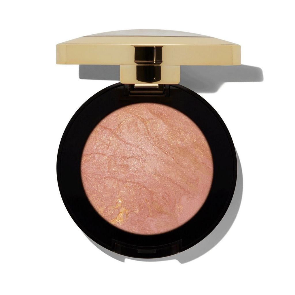 Compact blush with a gold lid on a white background