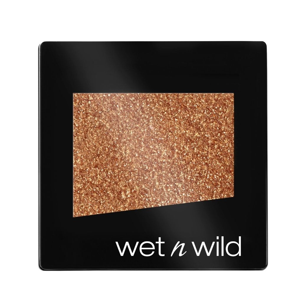 Wet n Wild eyeshadow palette with glittery bronze shade on a black background