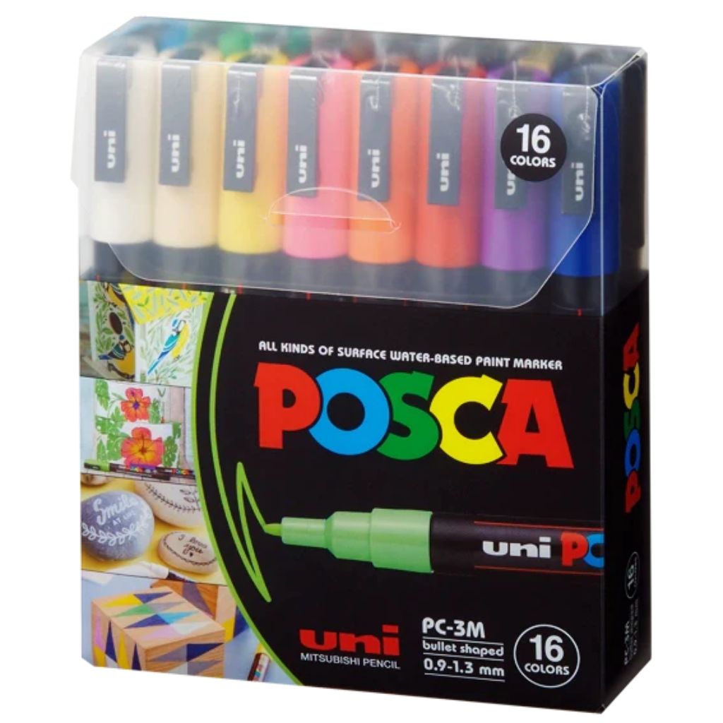 Box of Posca paint markers with colorful caps on a white background