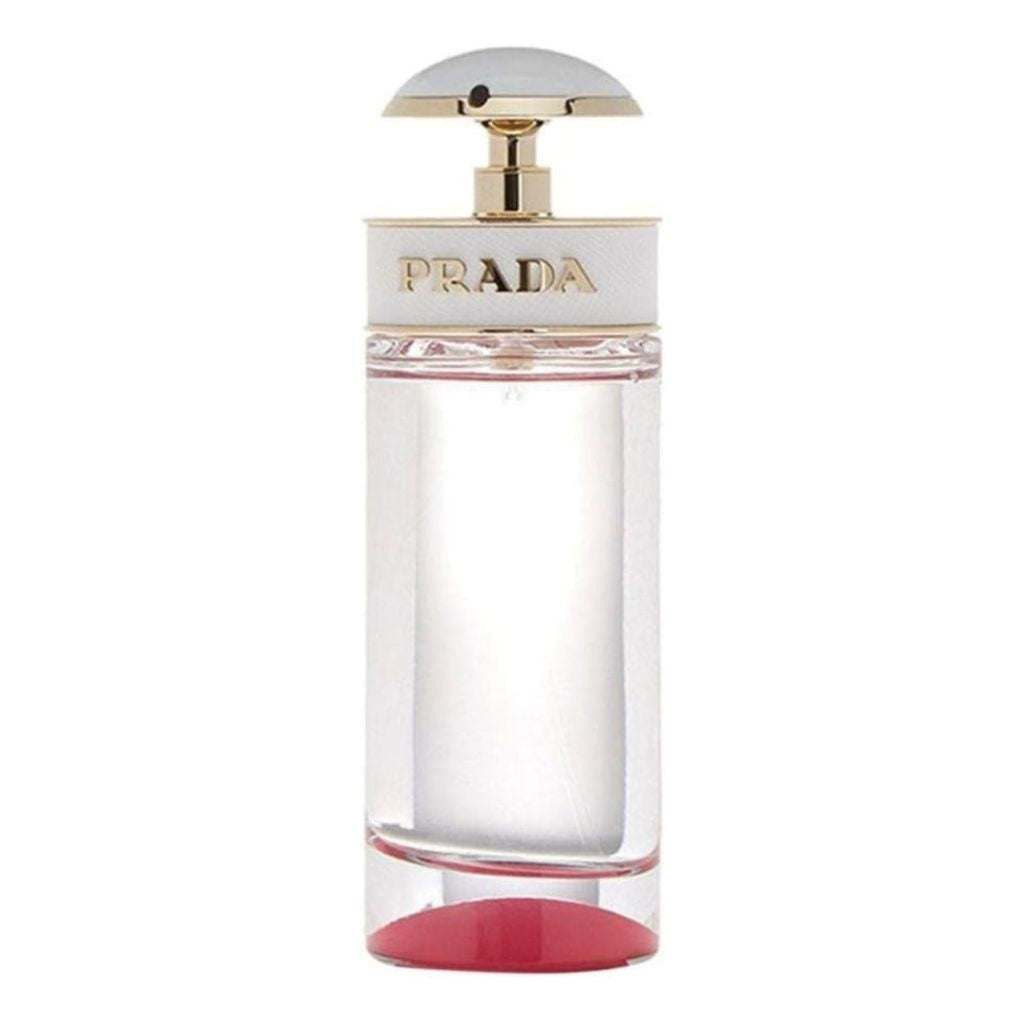 Prada perfume bottle with a gold cap on a white background