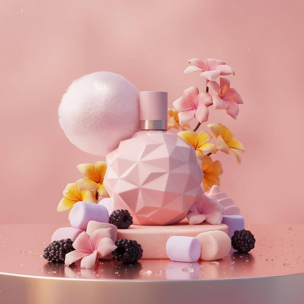 Pink geometric perfume bottle with flowers and blackberries on a pink background