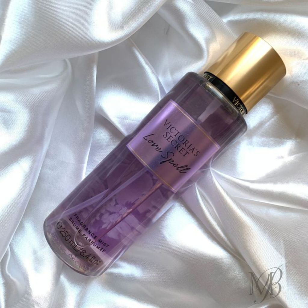 Victoria's Secret perfume bottle on a white fabric background
