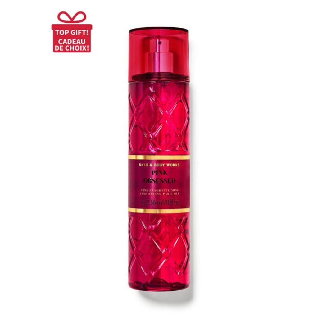 Red spray bottle with diamond pattern on a white background
