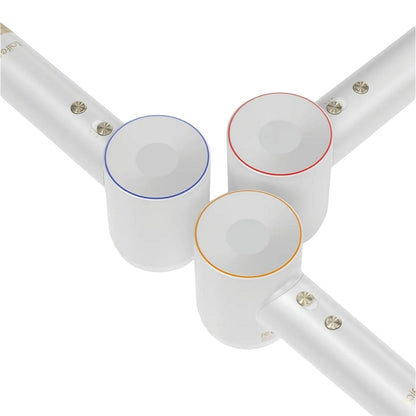White cylindrical objects with colored accents on a white background