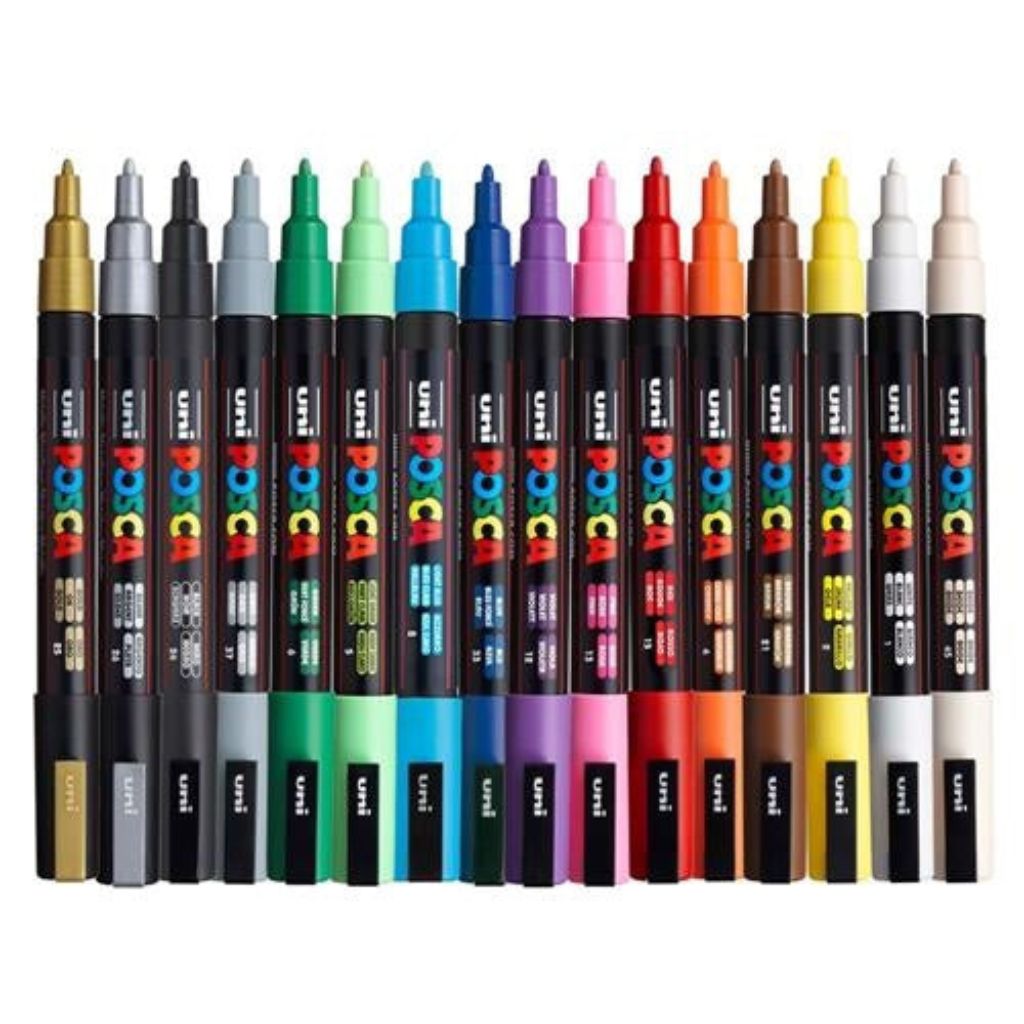 Box of Posca paint markers with colorful caps on a white background
