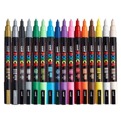 Box of Posca paint markers with colorful caps on a white background