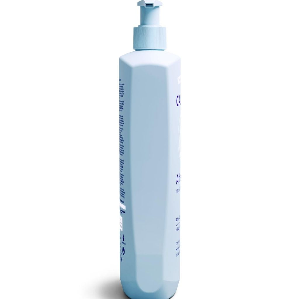 White bottle with pump on a white background