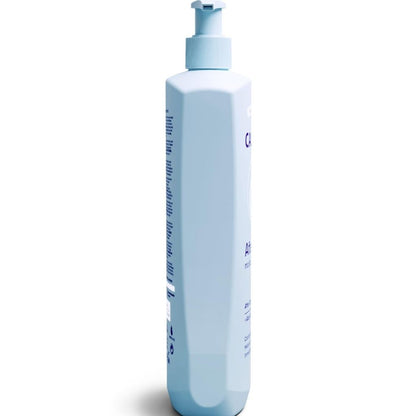 White bottle with pump on a white background