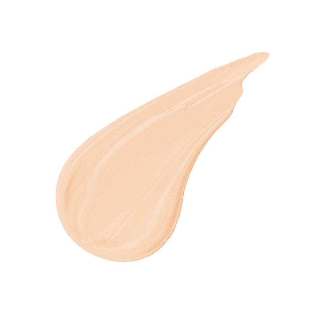 Beige cosmetic cream swatch on a white background