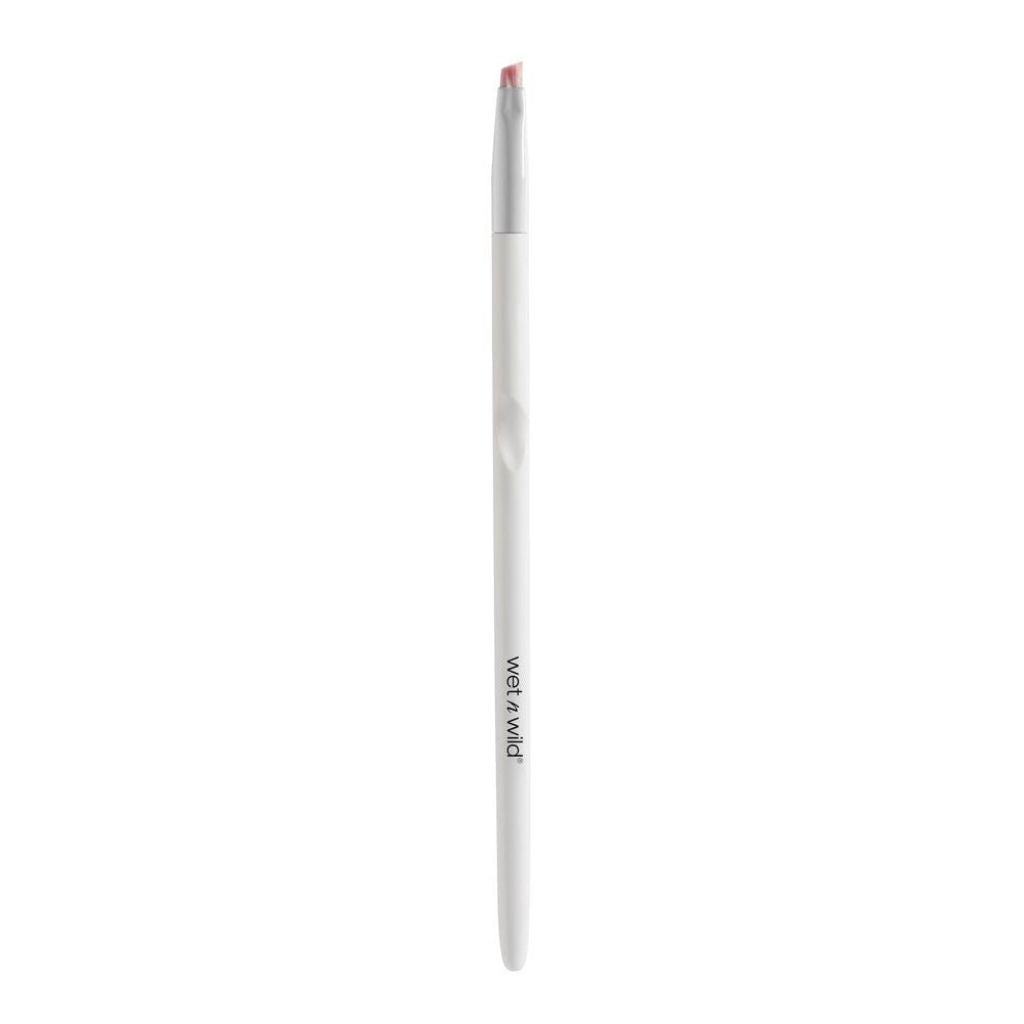 White makeup brush with red bristle tip on a white background