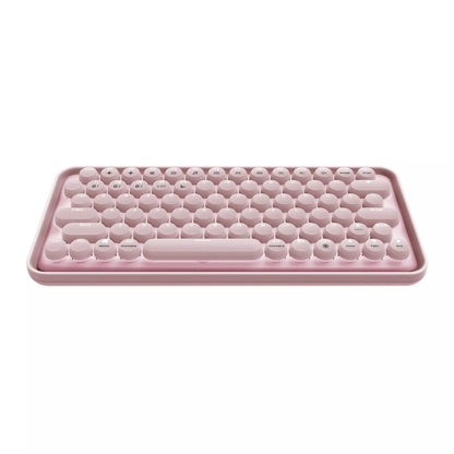 Pink silicone ice cube tray on a white background