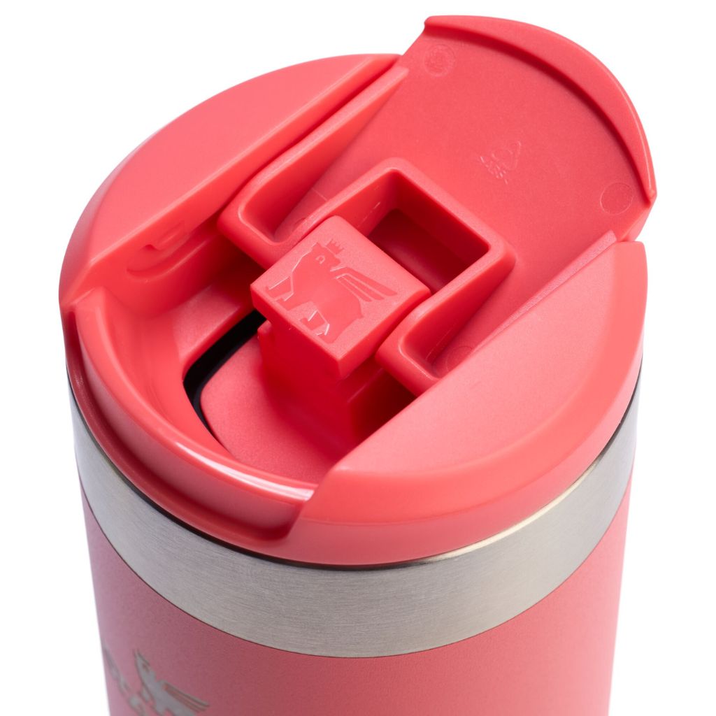 Close-up of a red travel mug with a silver base on a white background