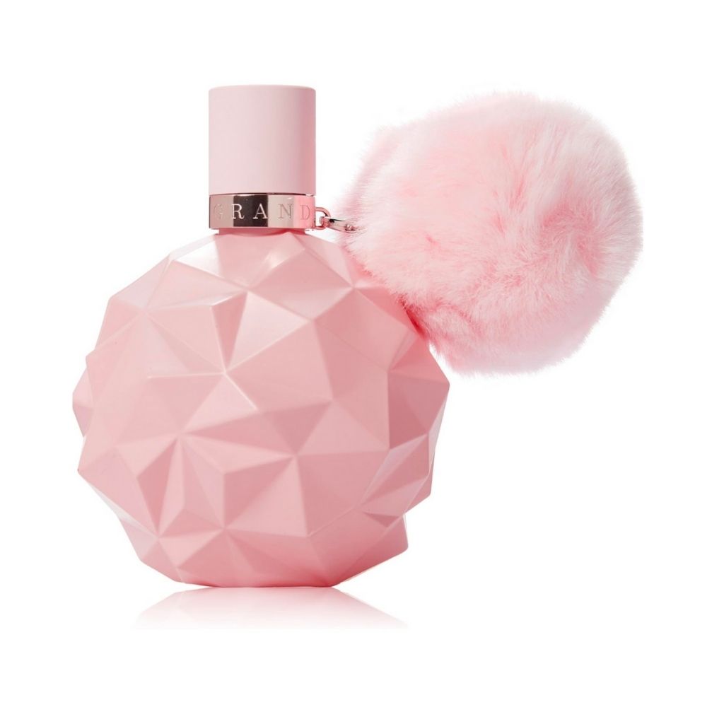 Pink geometric perfume bottle with a fluffy pink top on a white background