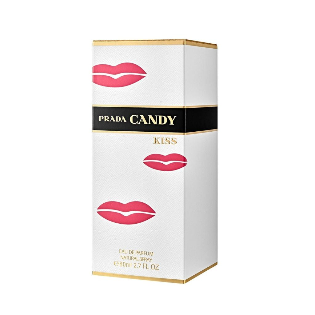 Prada Candy Kiss perfume box with pink lip prints on a white background