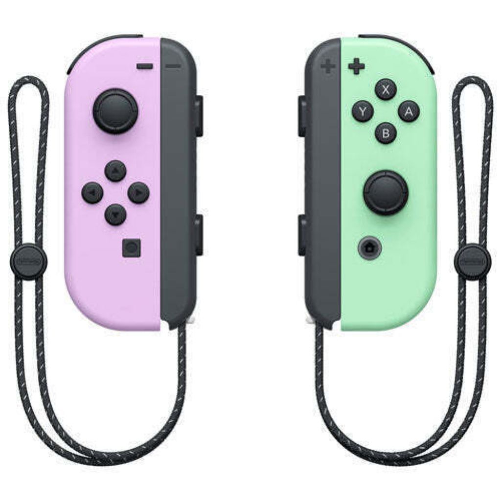 Pair of pink and green gaming controllers with black straps on a white background