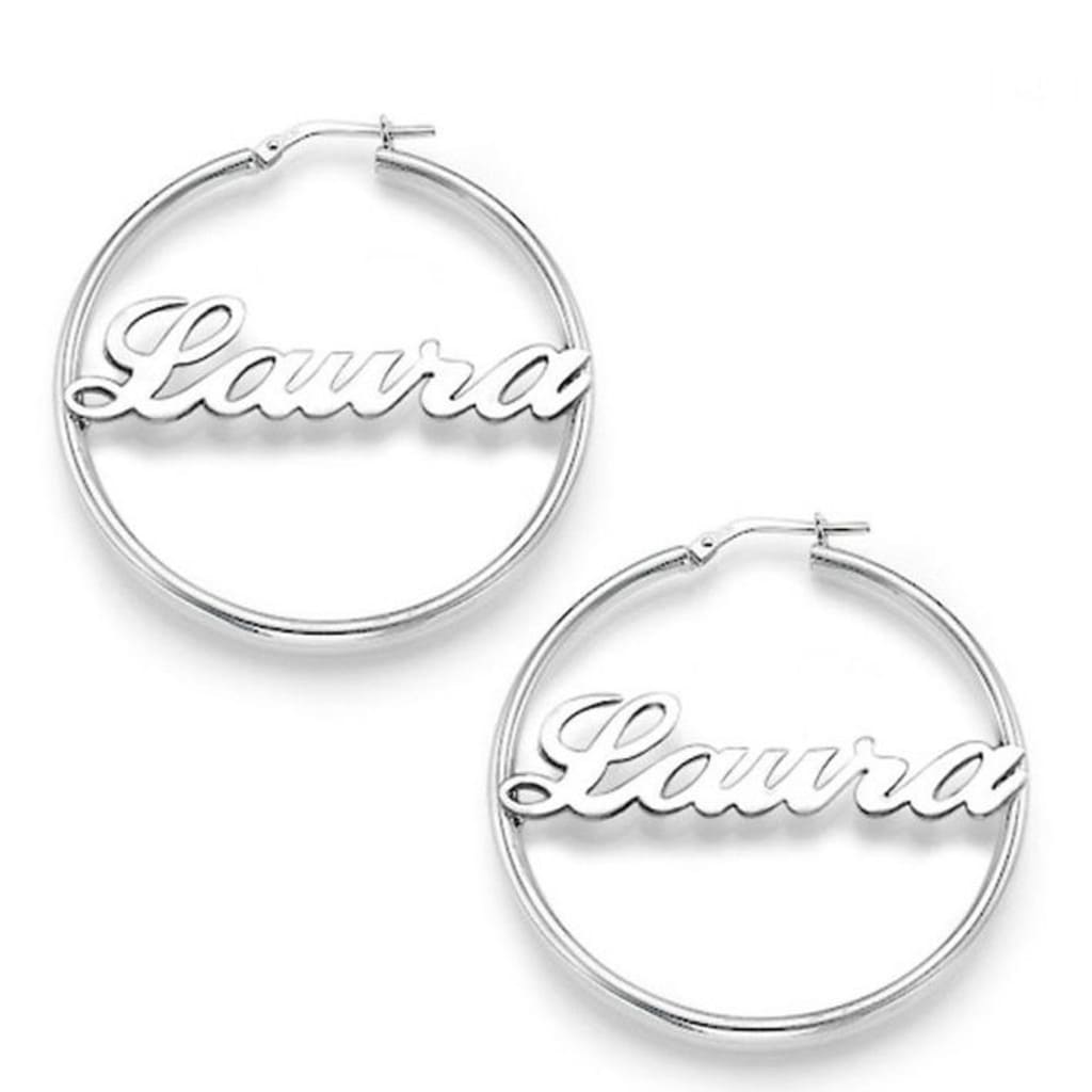 Silver hoop earrings with 'Laura' engraving on a white background