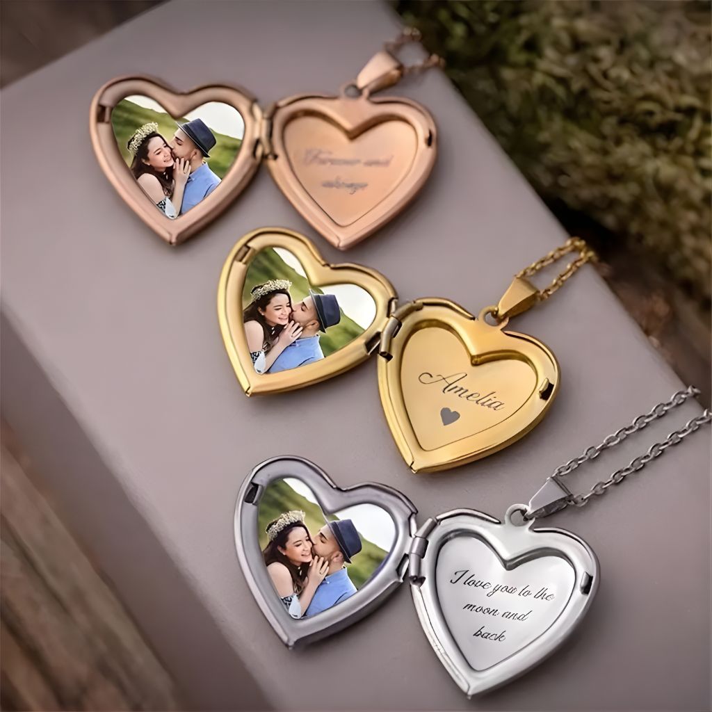 Heart-shaped photo locket with engraved messages on a wooden surface