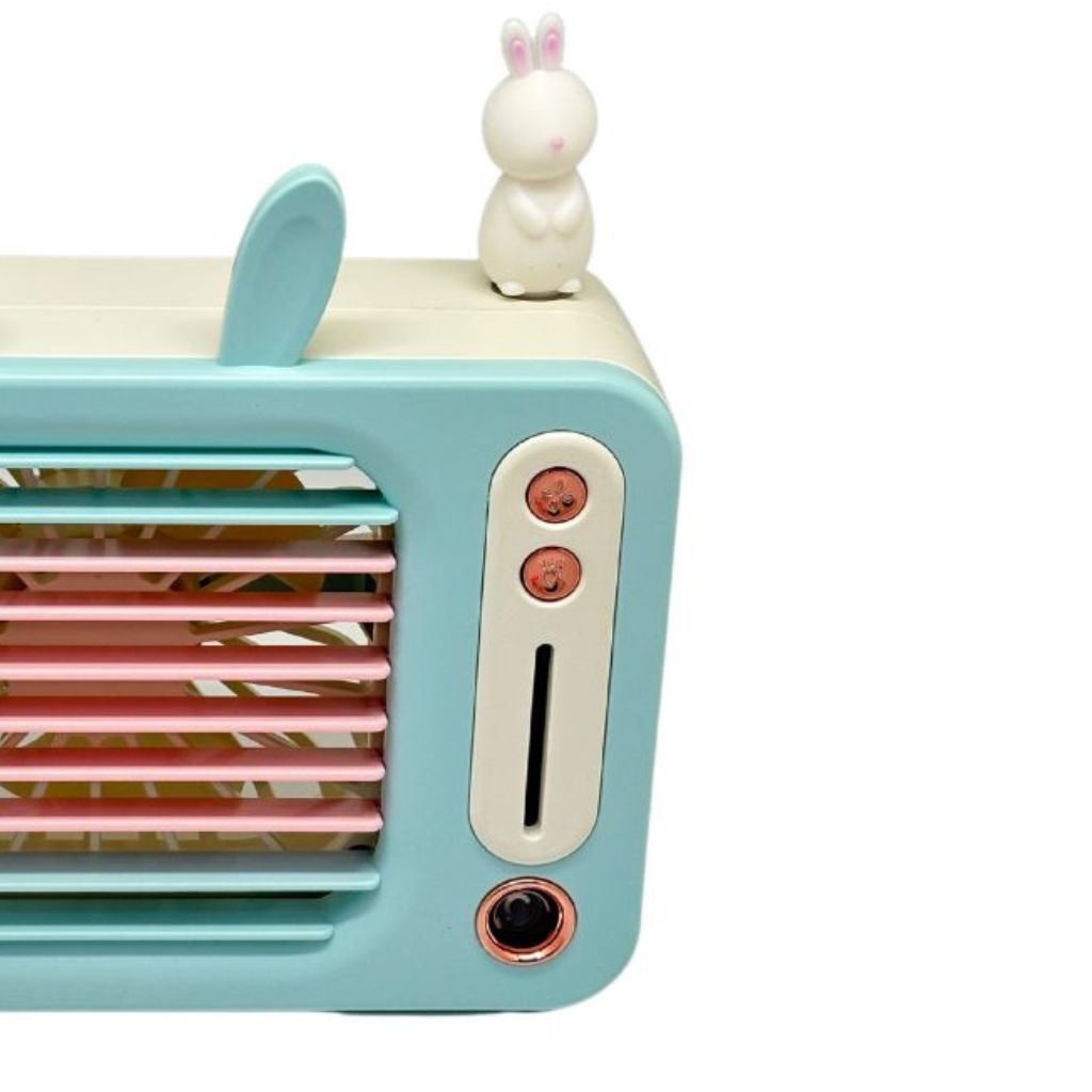 Toy television set with rabbit ears and a small rabbit figure on a white background