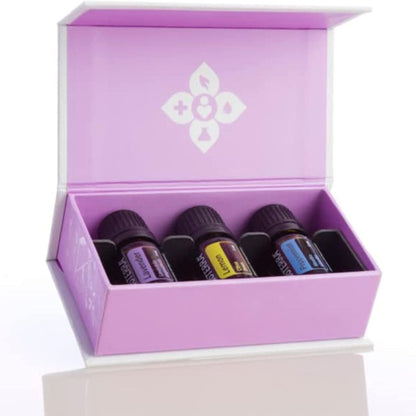 Set of essential oil bottles in a purple box with a white logo on a white background