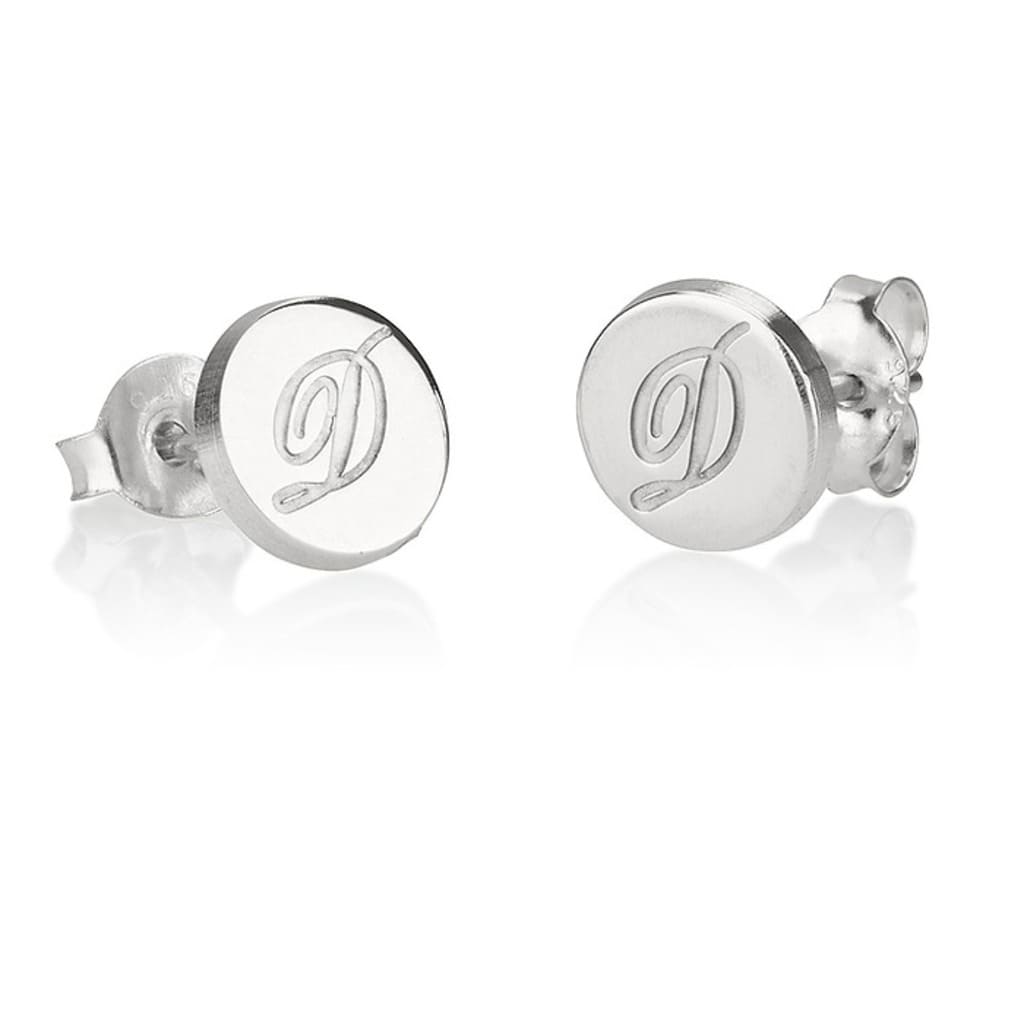 Silver earrings with an engraved letter 'D' on a white background