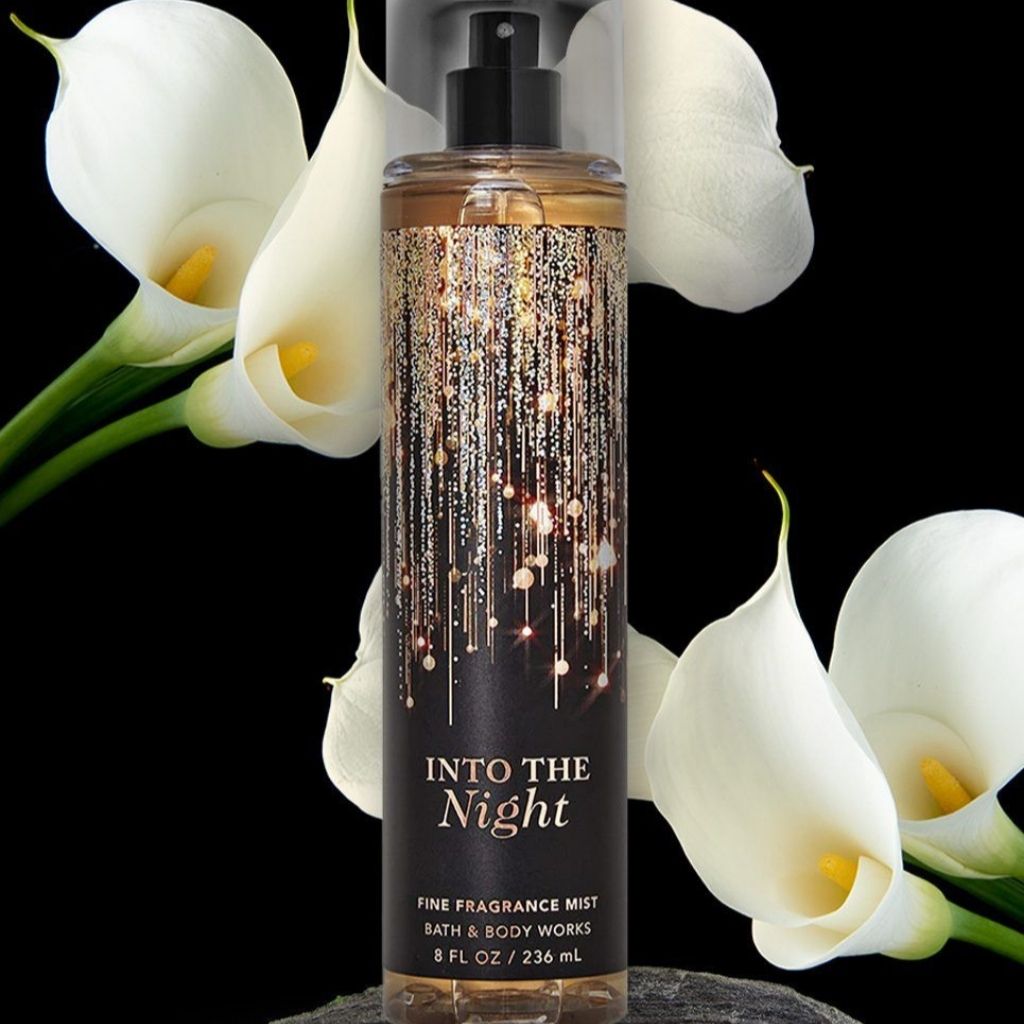 Bath & Body Works 'Into The Night' fine fragrance mist with white flowers in the background