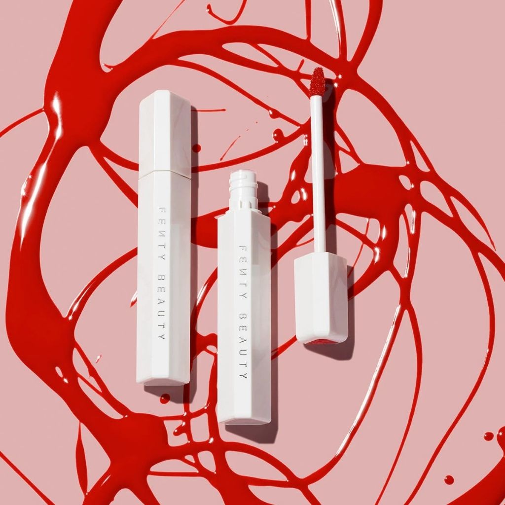 White cosmetic products on a pink background with red abstract designs