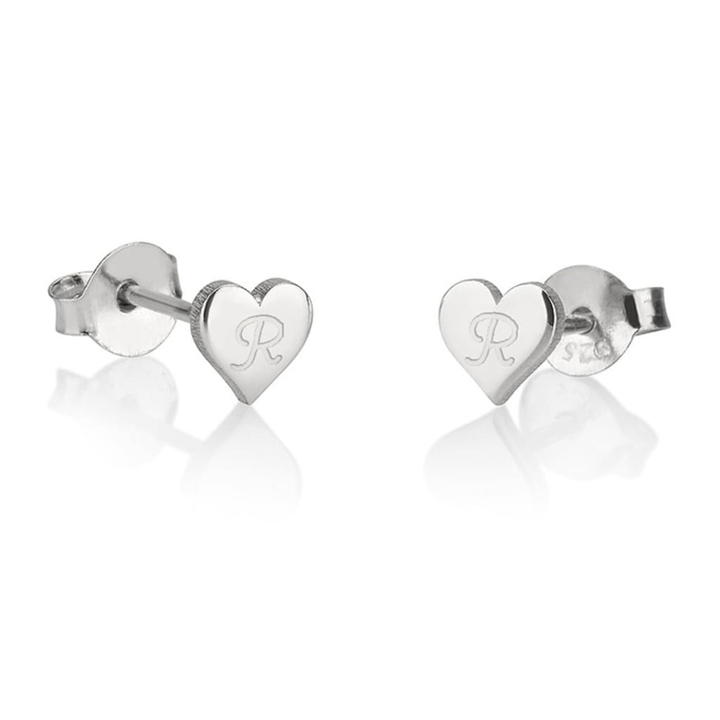 Heart-shaped silver earrings with engraved initials on a white background