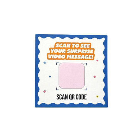 QR code sticker with text 'Scan to see your surprise video message!' on a white background