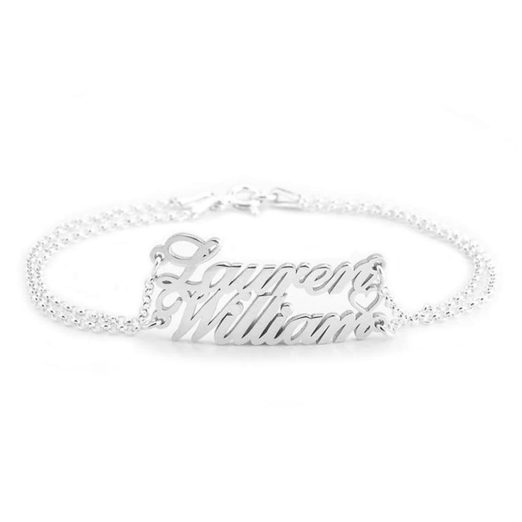Silver bracelet with 'Lauren Williams' engraving on a white background