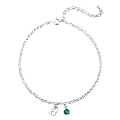 Silver bracelet with two charms on a white background