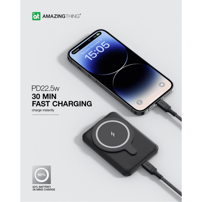 Wireless charging pad with smartphone on a white background, featuring 'Amazing Thing' branding.
