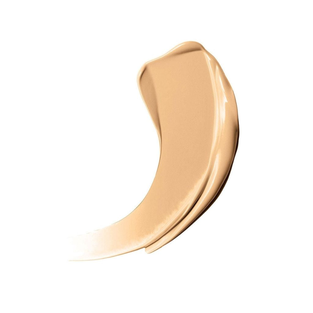 Beige cosmetic cream swatch on a white background