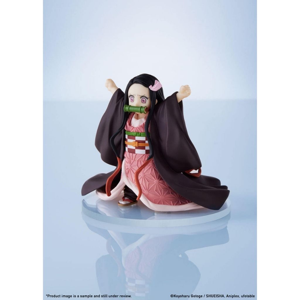 Figurine of a character from an anime on a light blue background