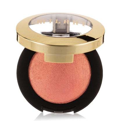 Compact blush with gold lid and black case on a white background