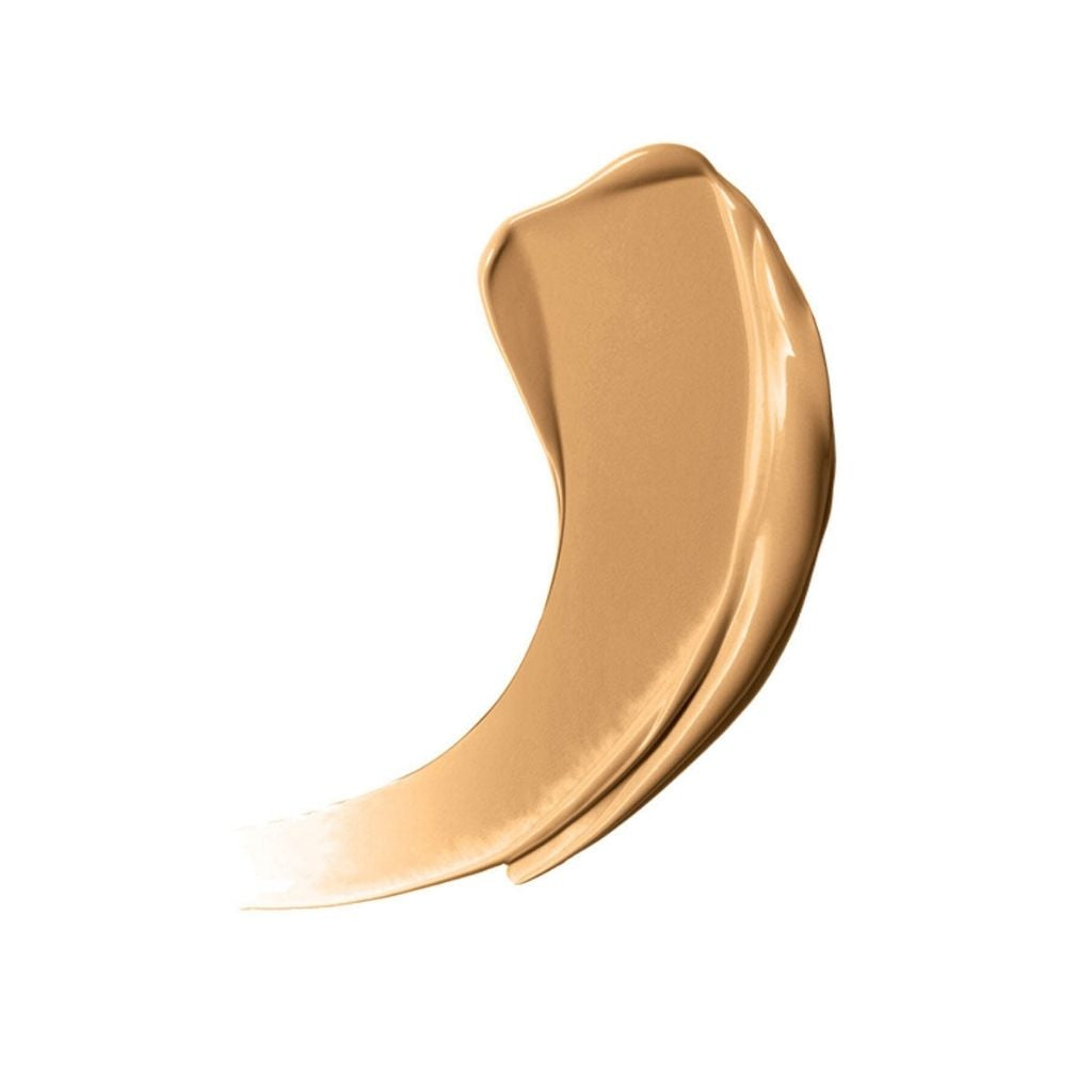 Beige cosmetic cream swatch on a white background