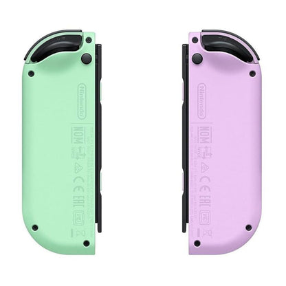 Two colorful lighters, one green and one purple, on a white background.