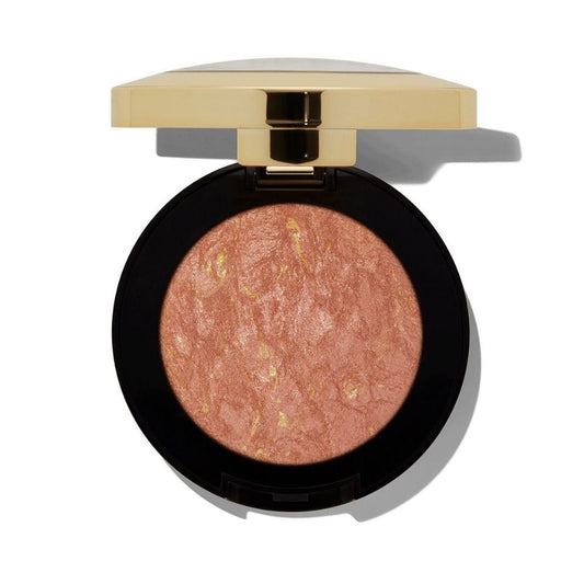 Compact blush with gold lid on a white background