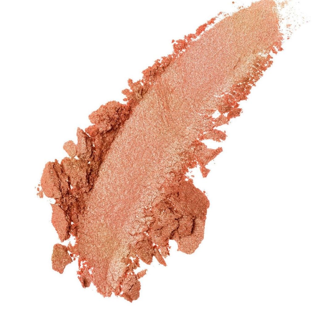 Nude-colored makeup powder swatch on a white background