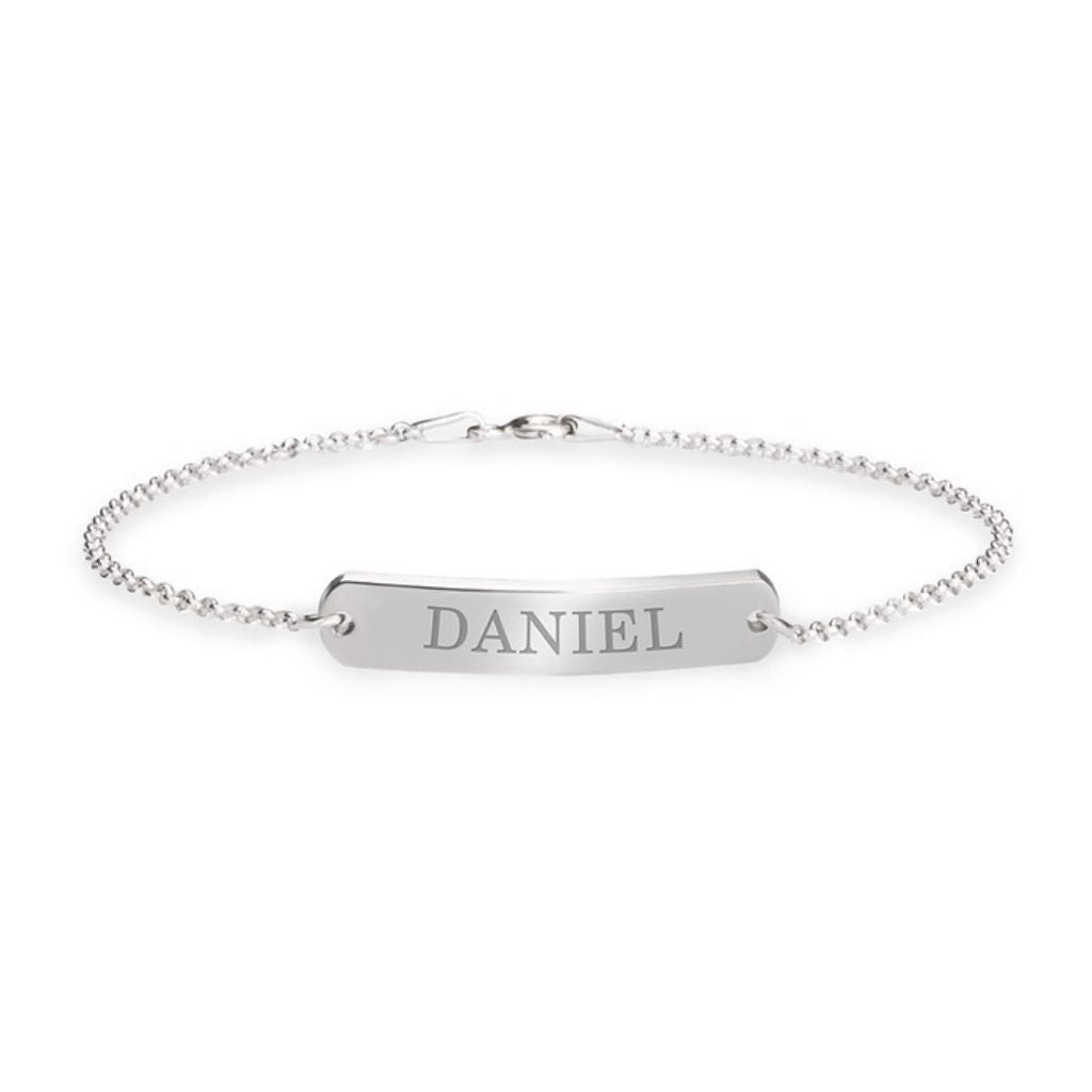 Silver bracelet with a bar pendant engraved with 'DANIEL' on a white background