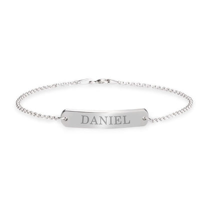 Silver bracelet with a bar pendant engraved with 'DANIEL' on a white background