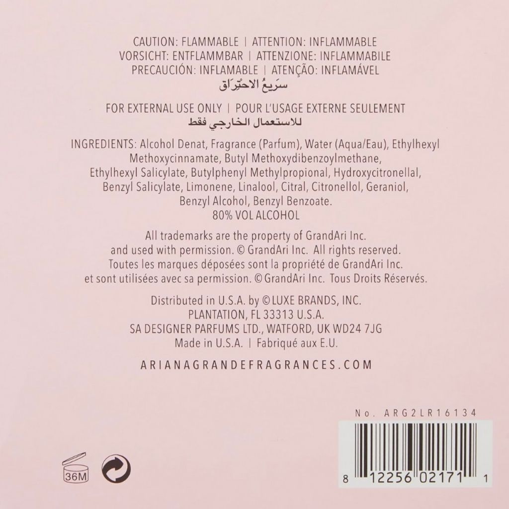 Back label of a perfume bottle with text and product details on a light pink background
