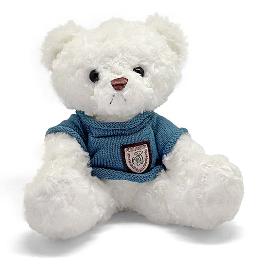 White teddy bear wearing a blue sweater with a logo on a white background