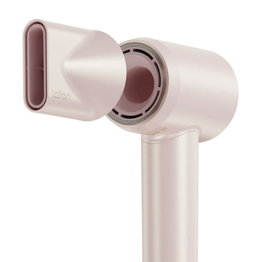 White hair dryer with pink accents on a white background