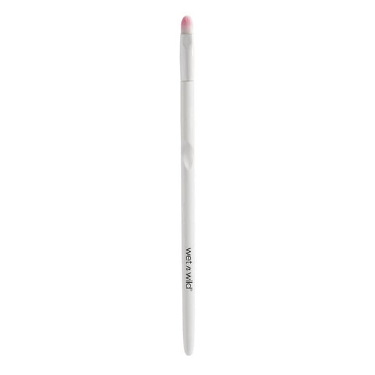 White makeup pencil with pink cap on a white background